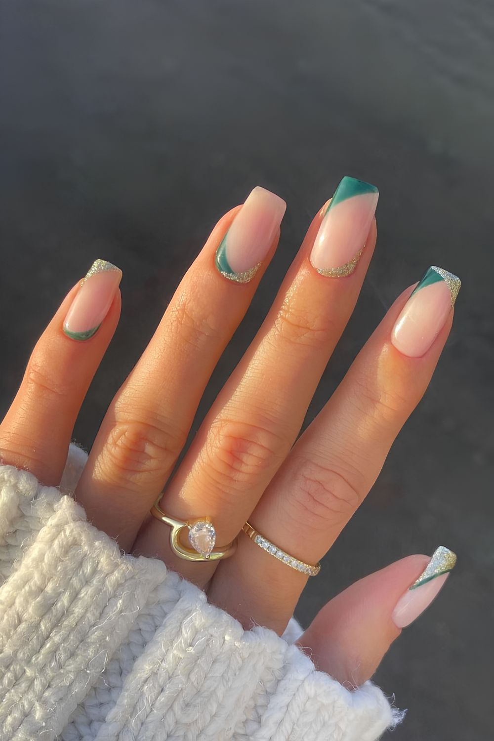 Nude nails with silver and green reverse tips