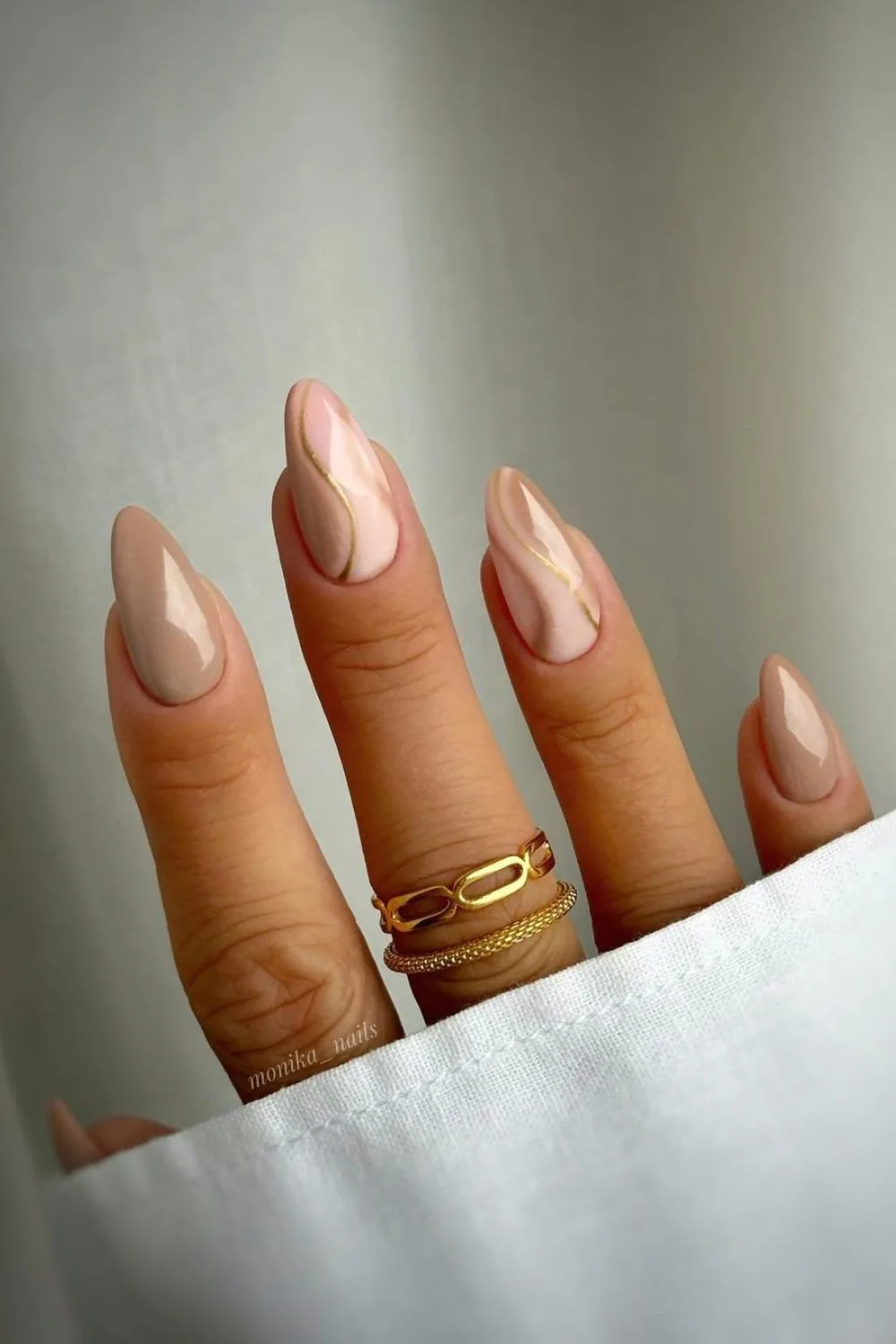 Nude nails with swirl and gold accents