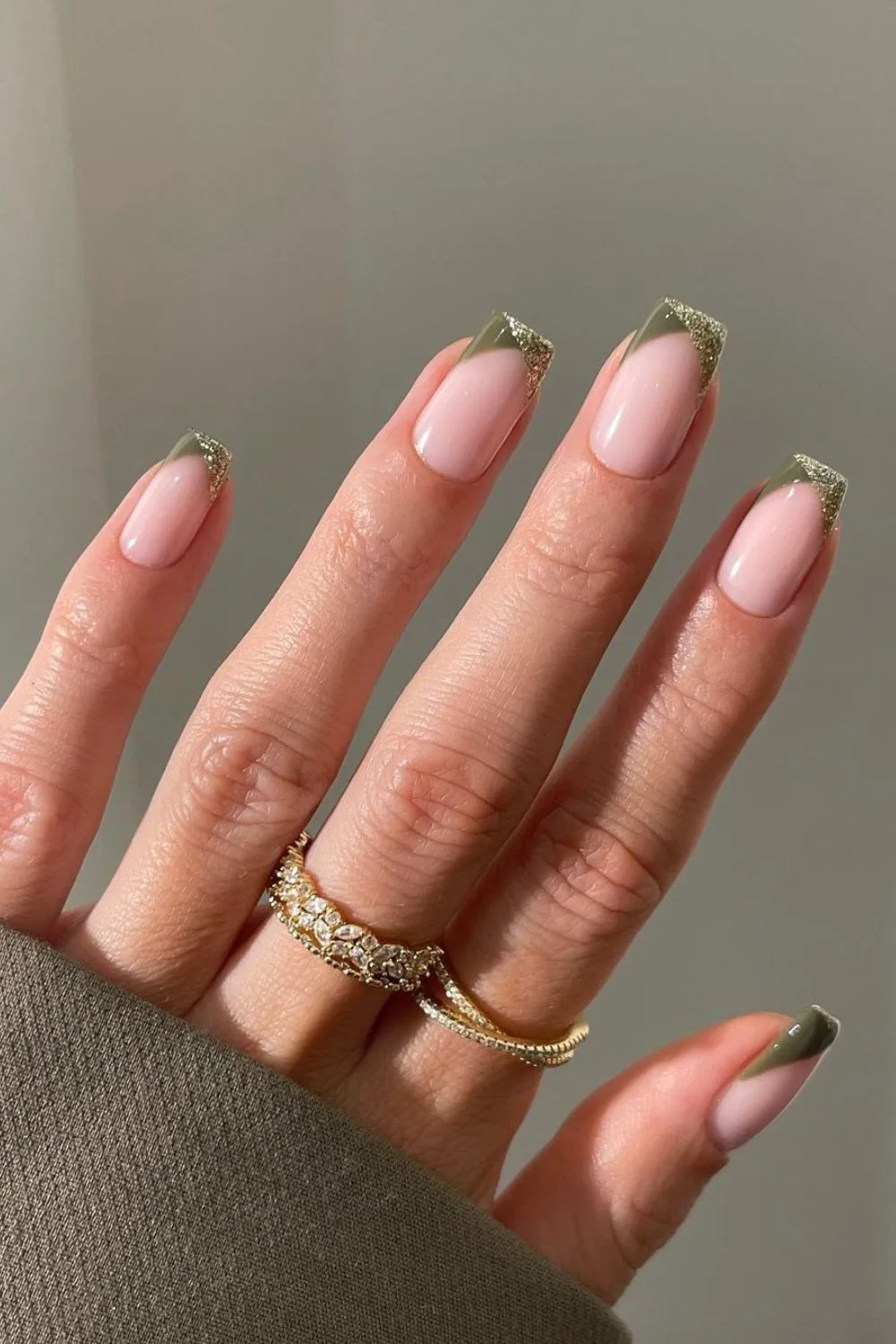 Olive and gold pointed French tip nails