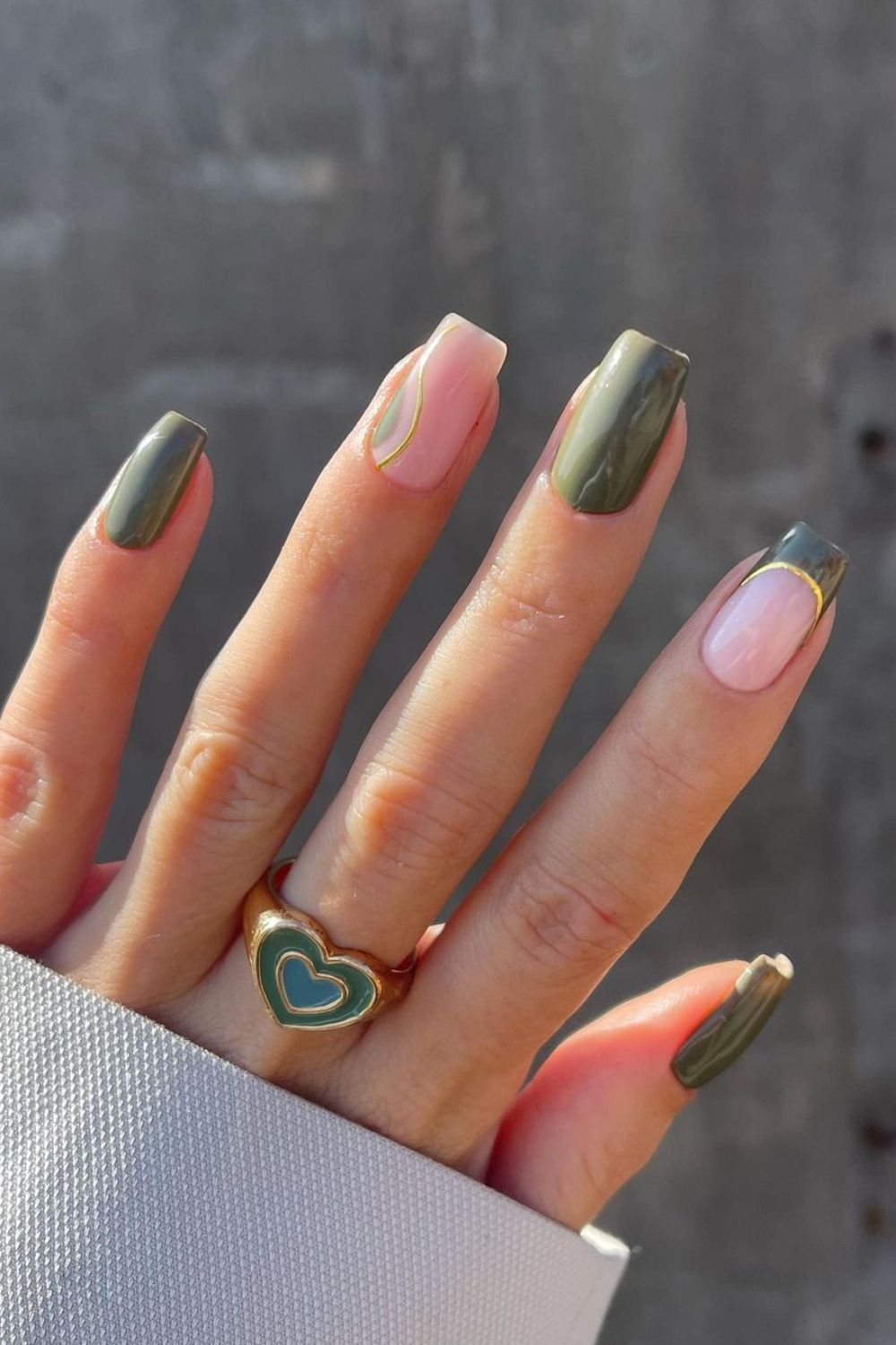 Olive green nails with gold line accents