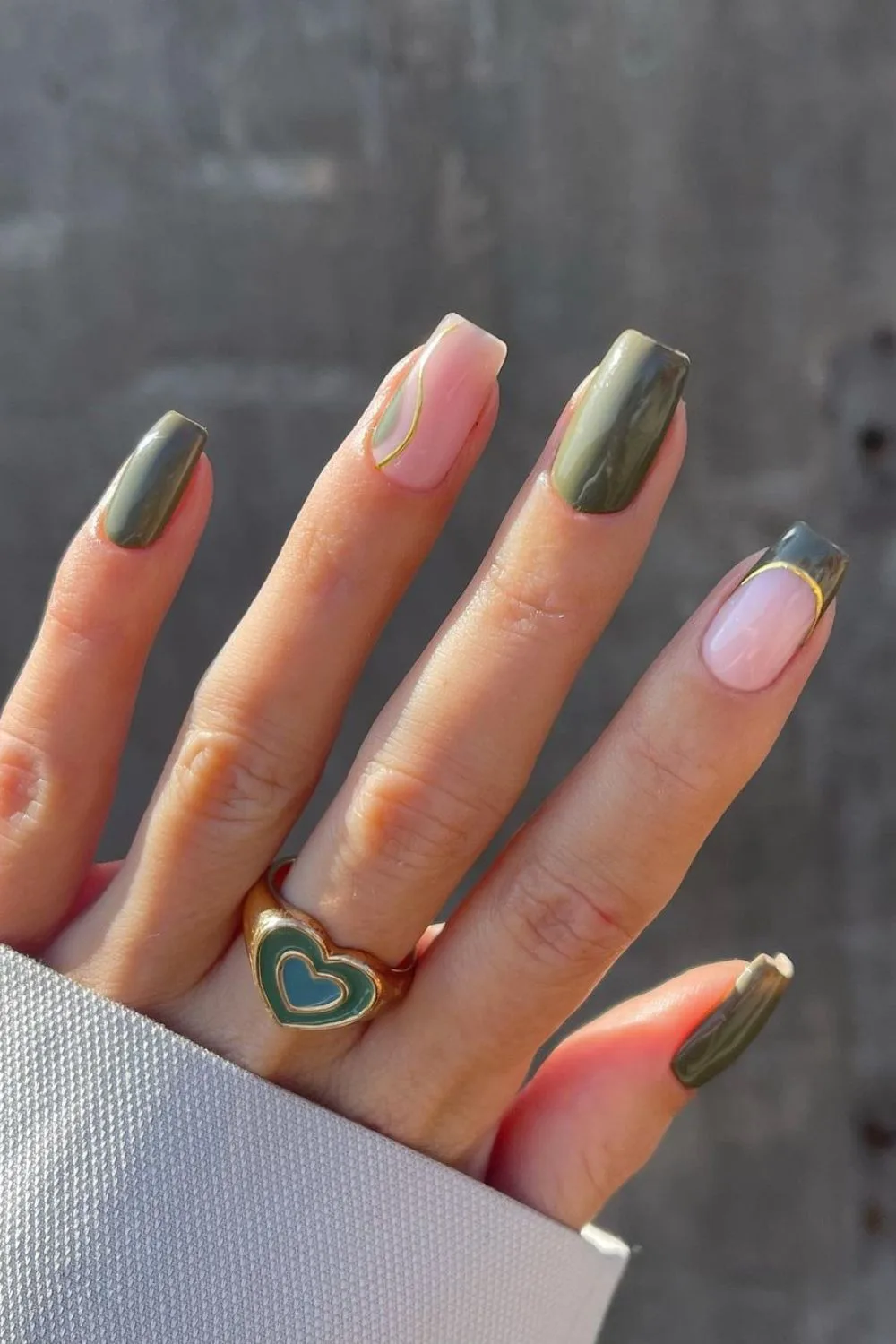 Olive green nails with gold line accents