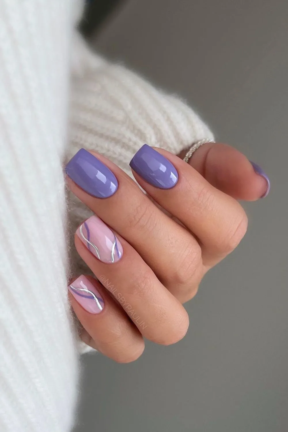 Periwinkle nails with swirl accents