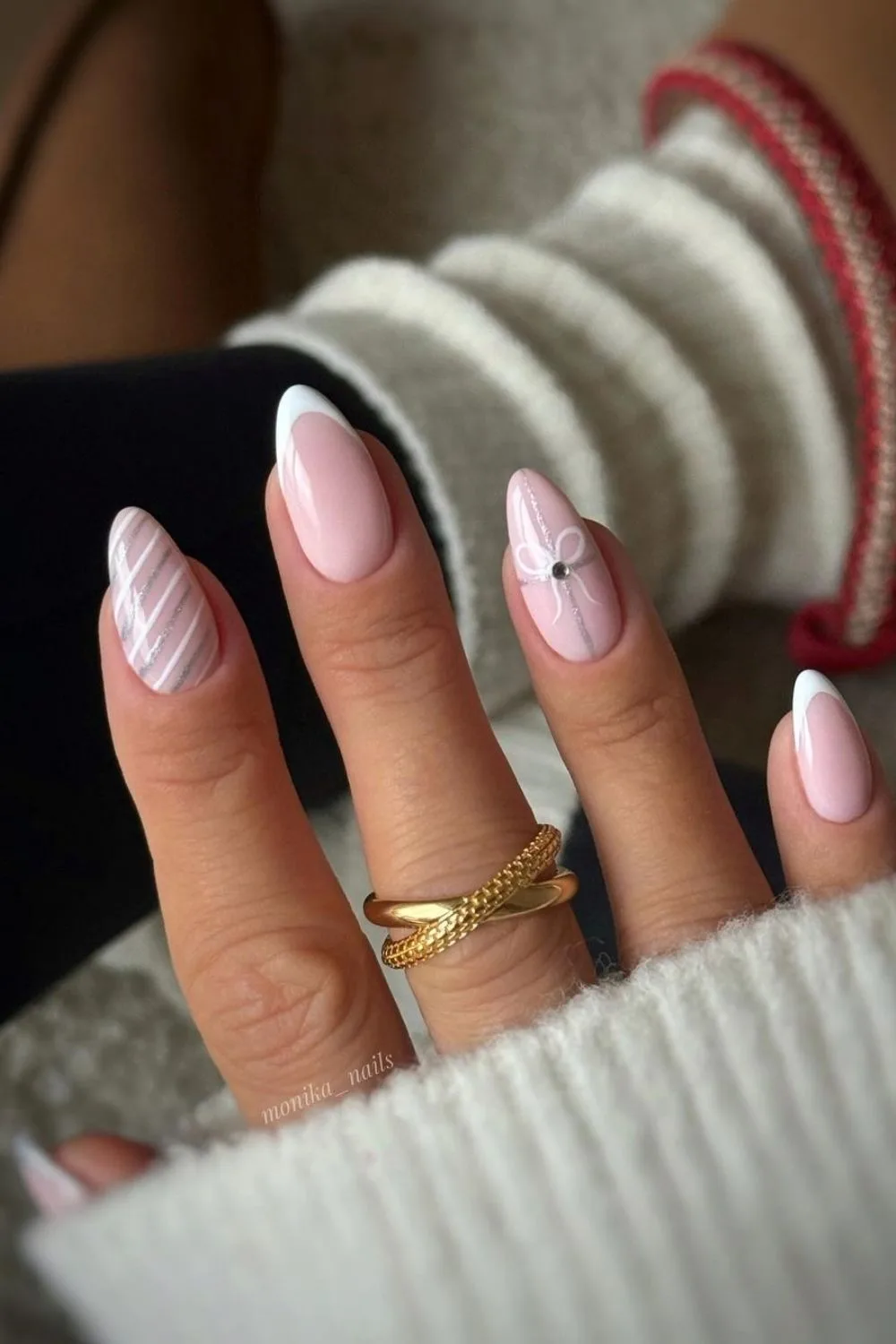 Pink Christmas nails with white and silver festive accents