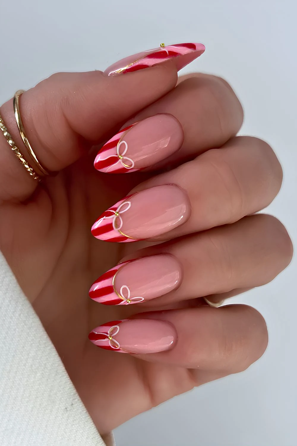 Pink and red striped French mani with bows