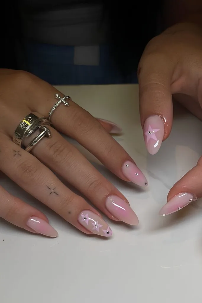 Pink aura nails with star accents