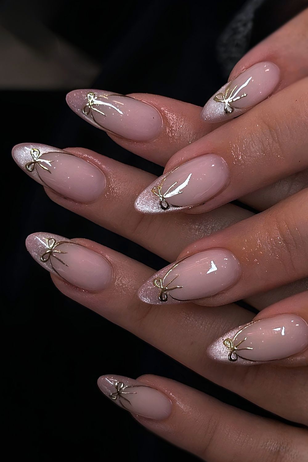 Pink cat eye French mani with gold bows