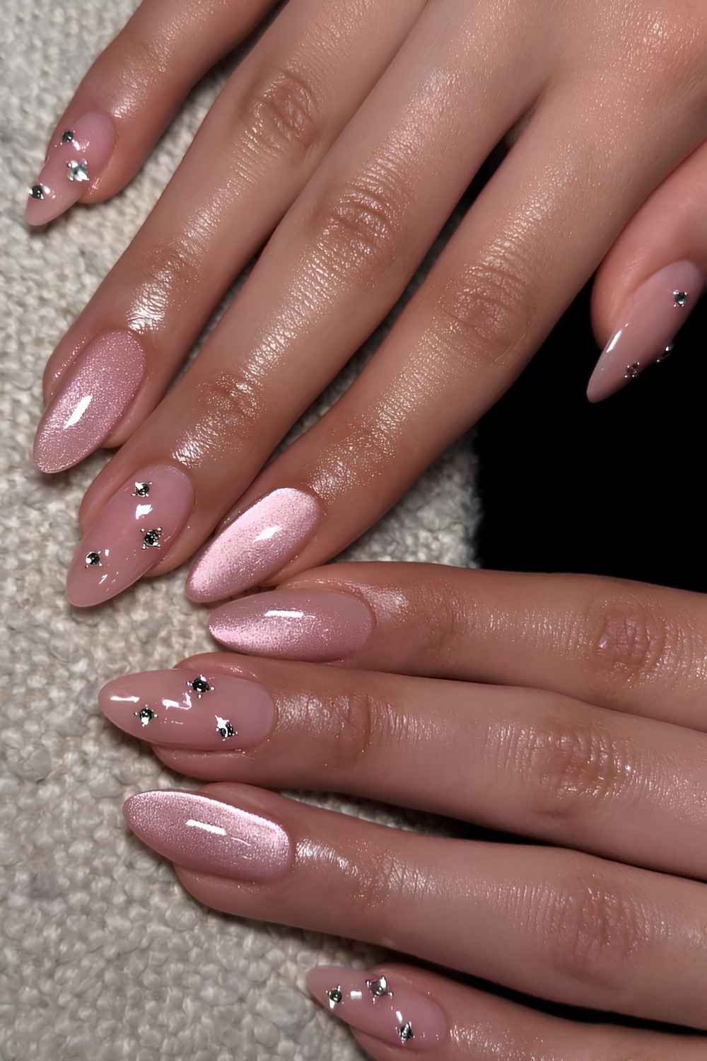 Pink cat eye nails with rhinestones