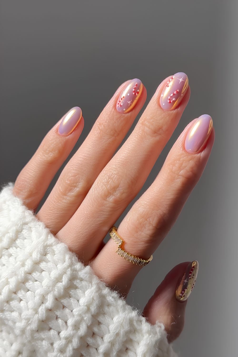 Pink chrome nails with candy cane accents