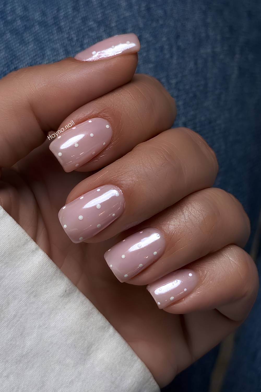 Pink chrome nails with polka dots