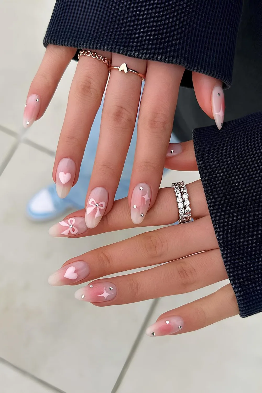 Pink coquette nails with hearts, stars and bows