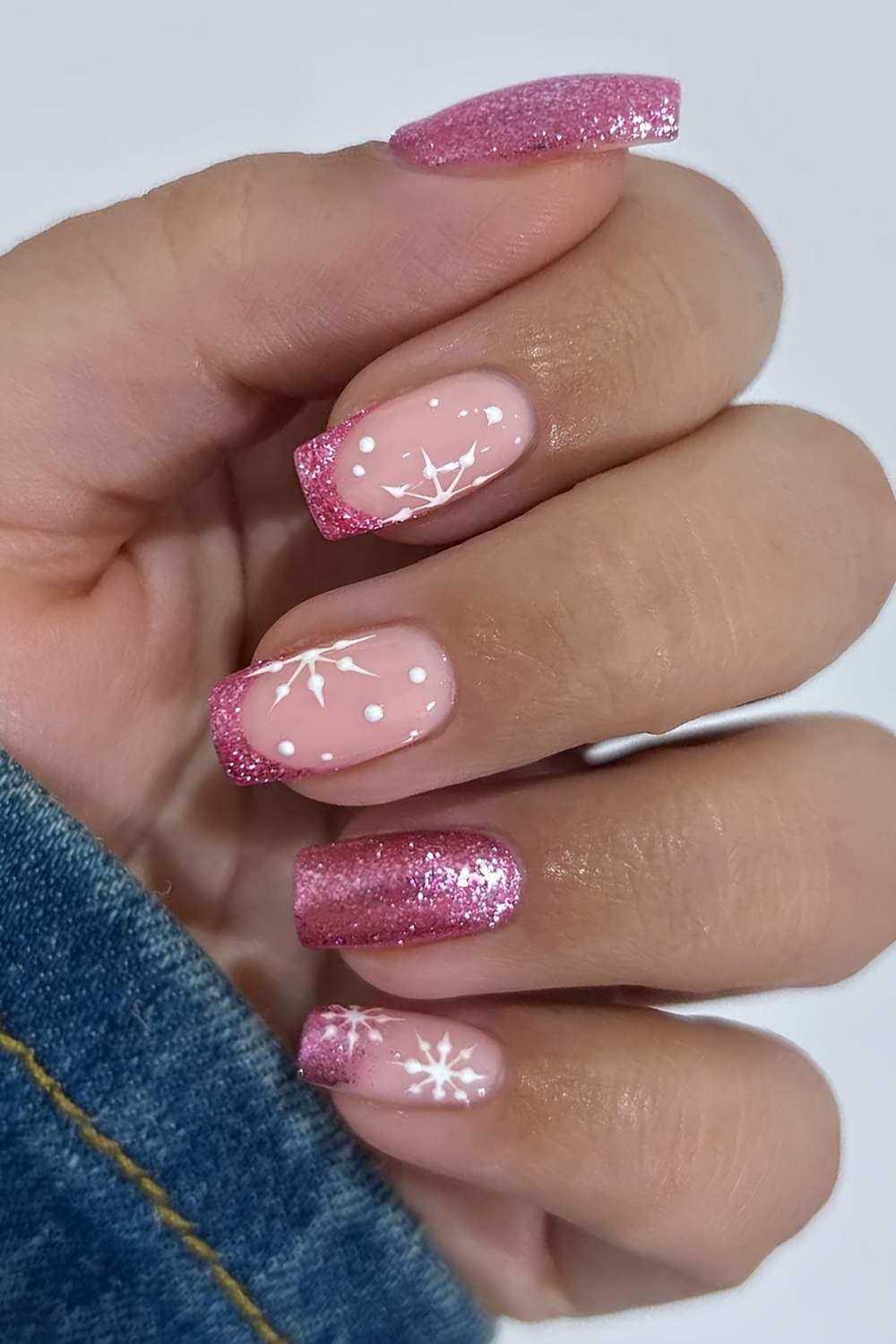 Pink glitter Christmas-themed nails
