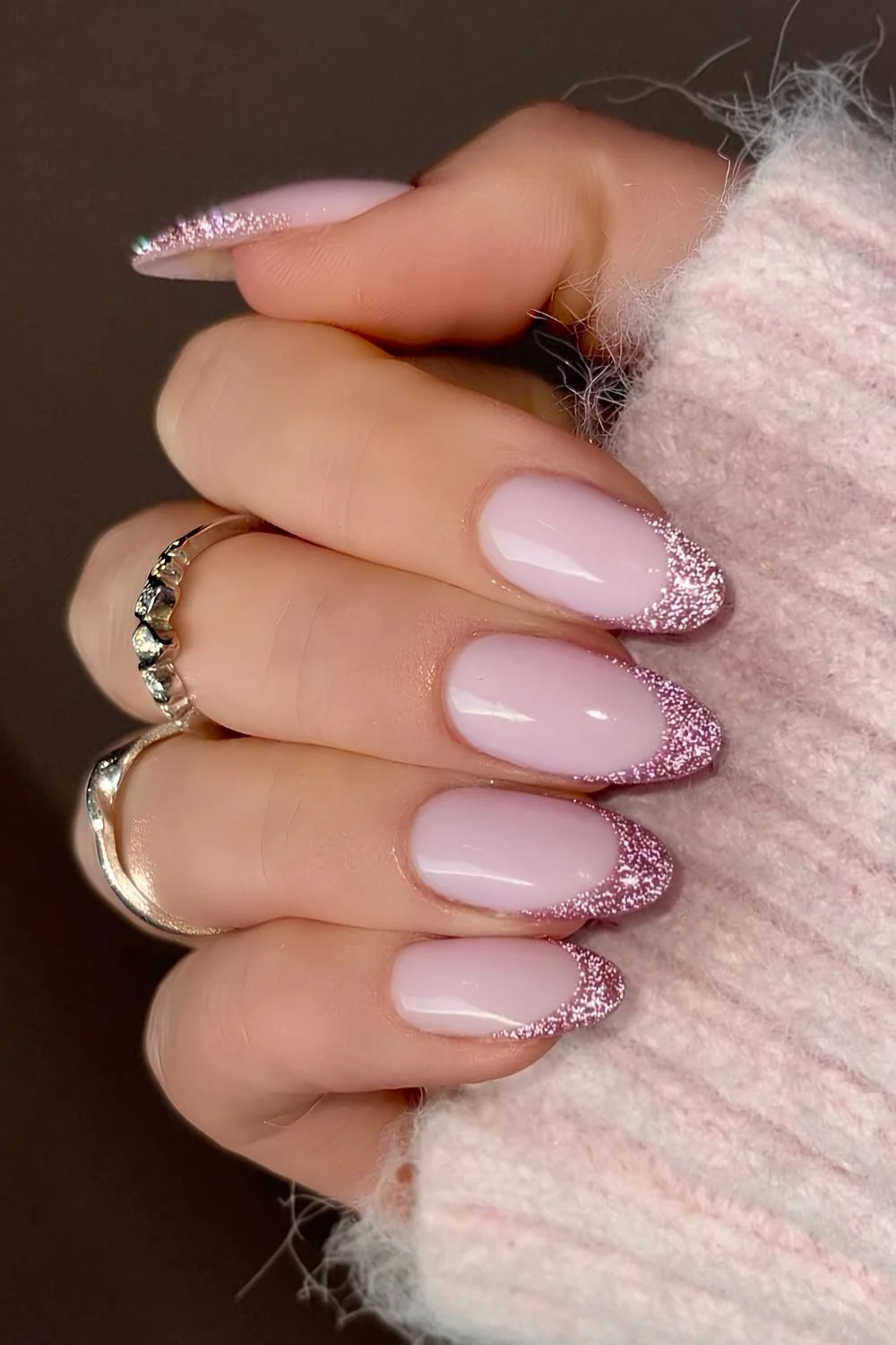 Pink glitter French mani on a milky base