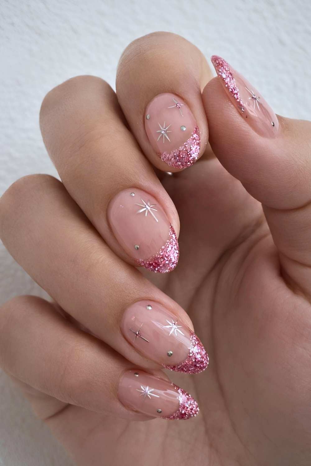 Pink glitter French nails with celestial art