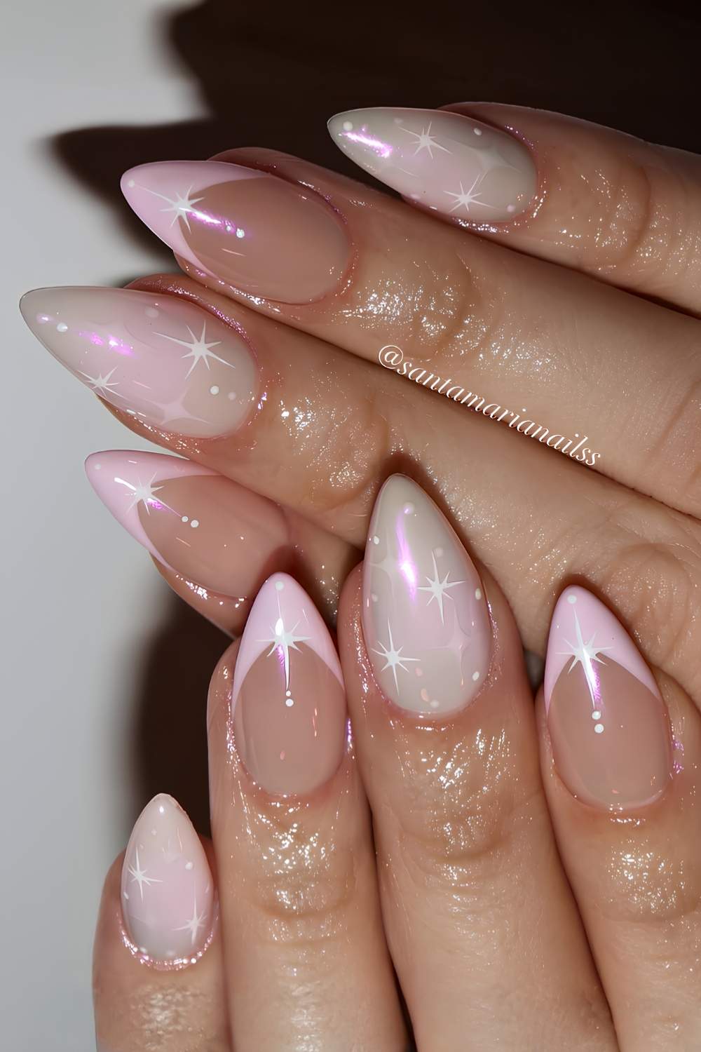 Pink nails with celestial art and chrome accents