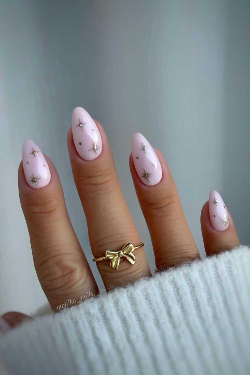 Baby pink nails with celestial motives