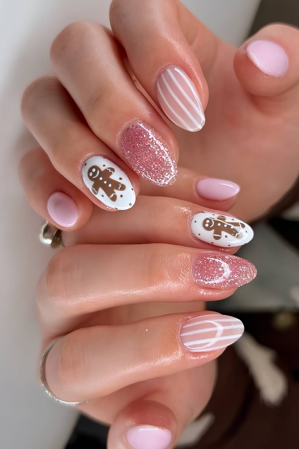 Pink nails with gingerbread and stripe art