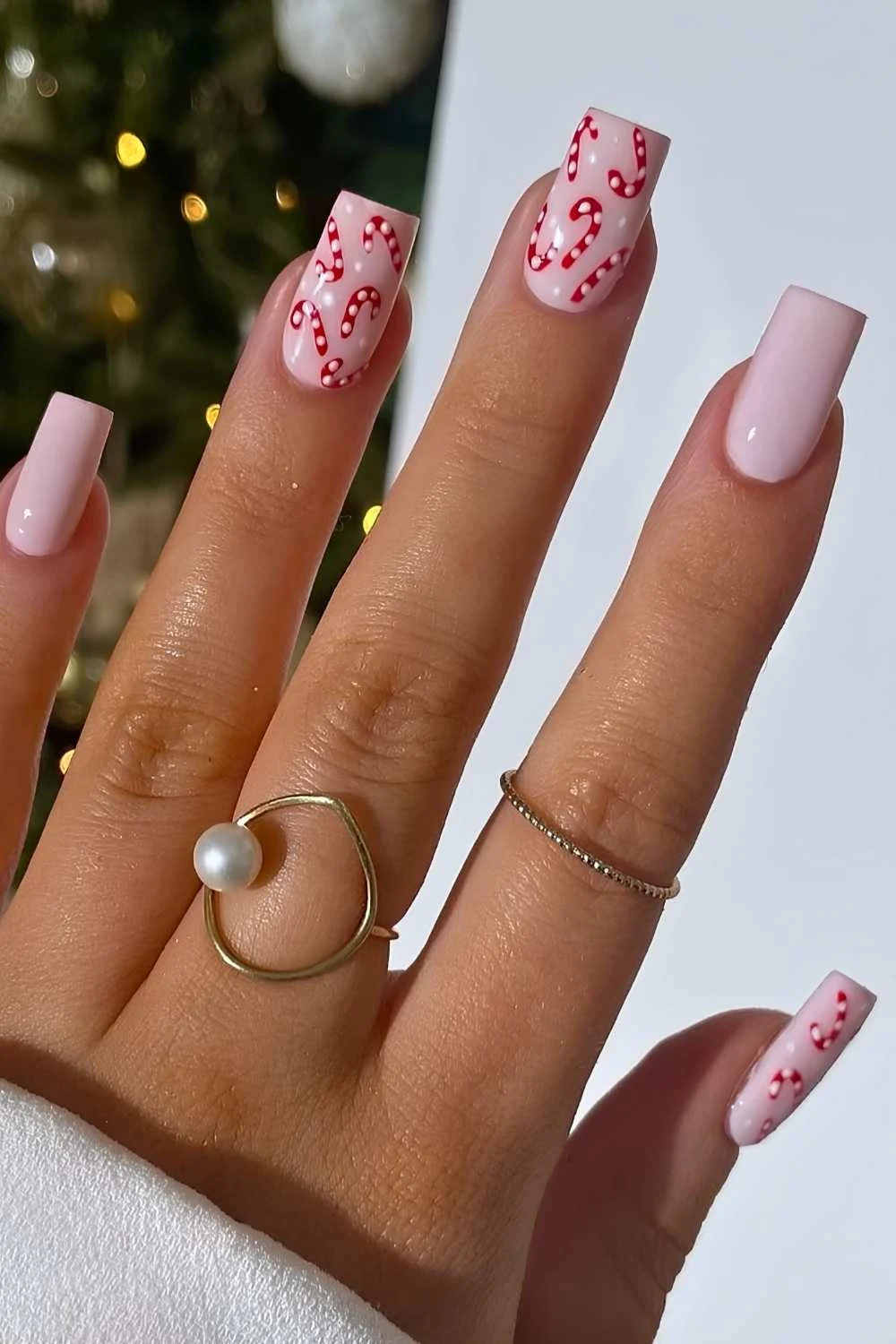 Pink nails with micro candy cane art