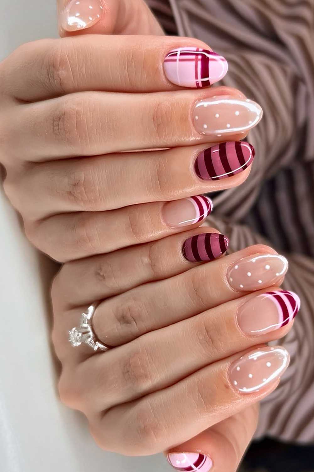 Pink nails with stripe and polka dot art