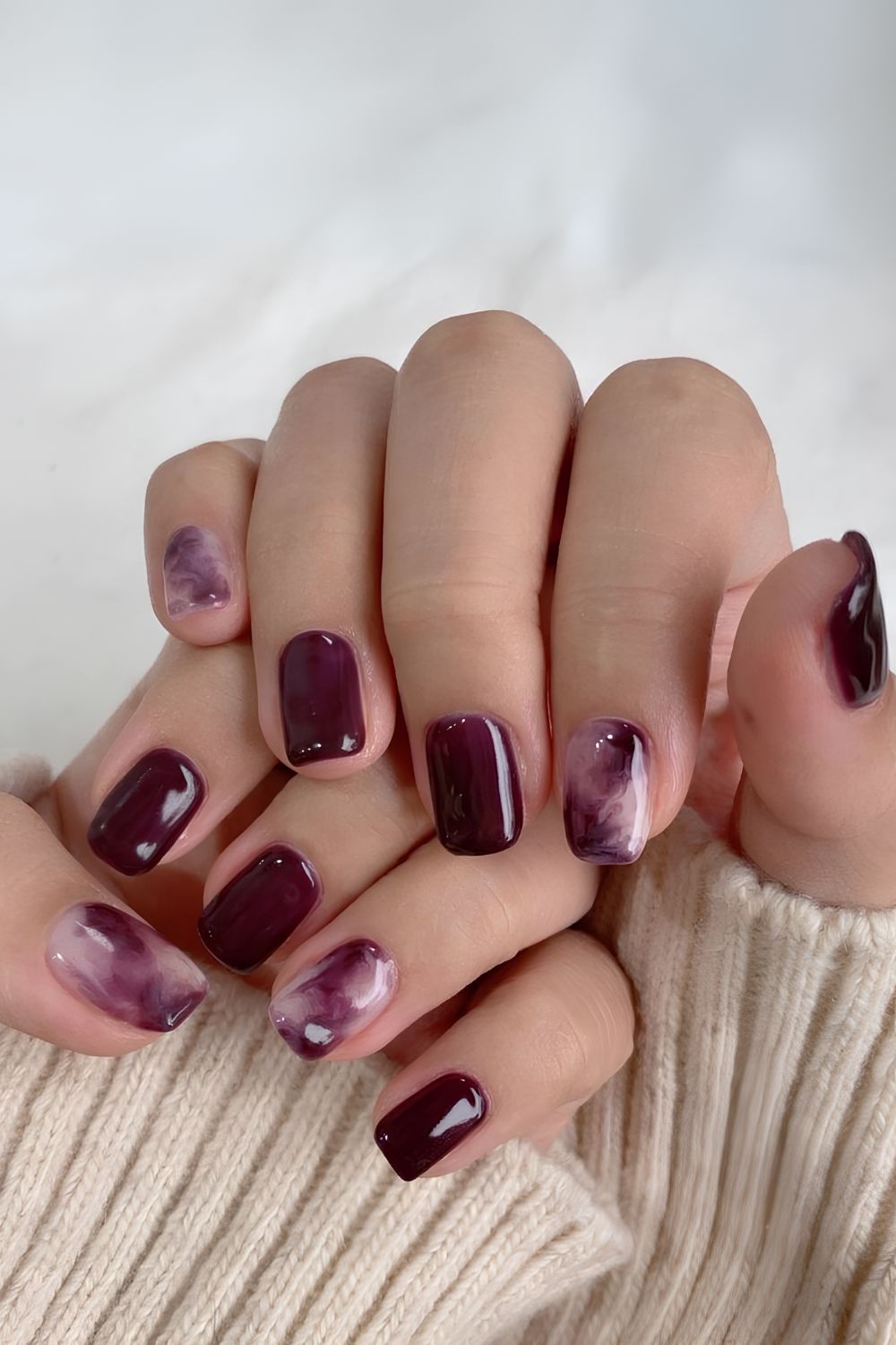 Plum nails with marble accents