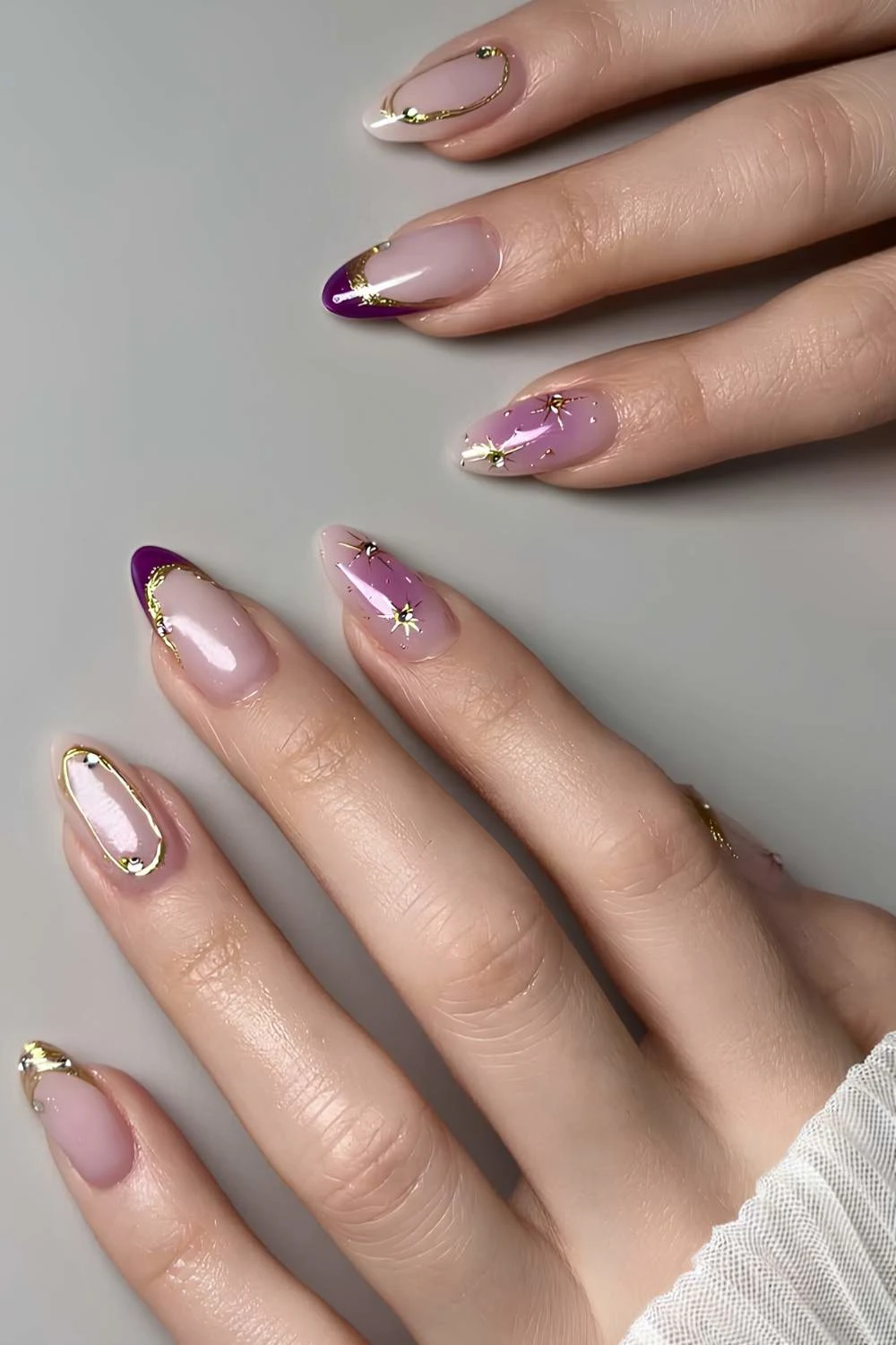 Purple French mani with gold details and stars