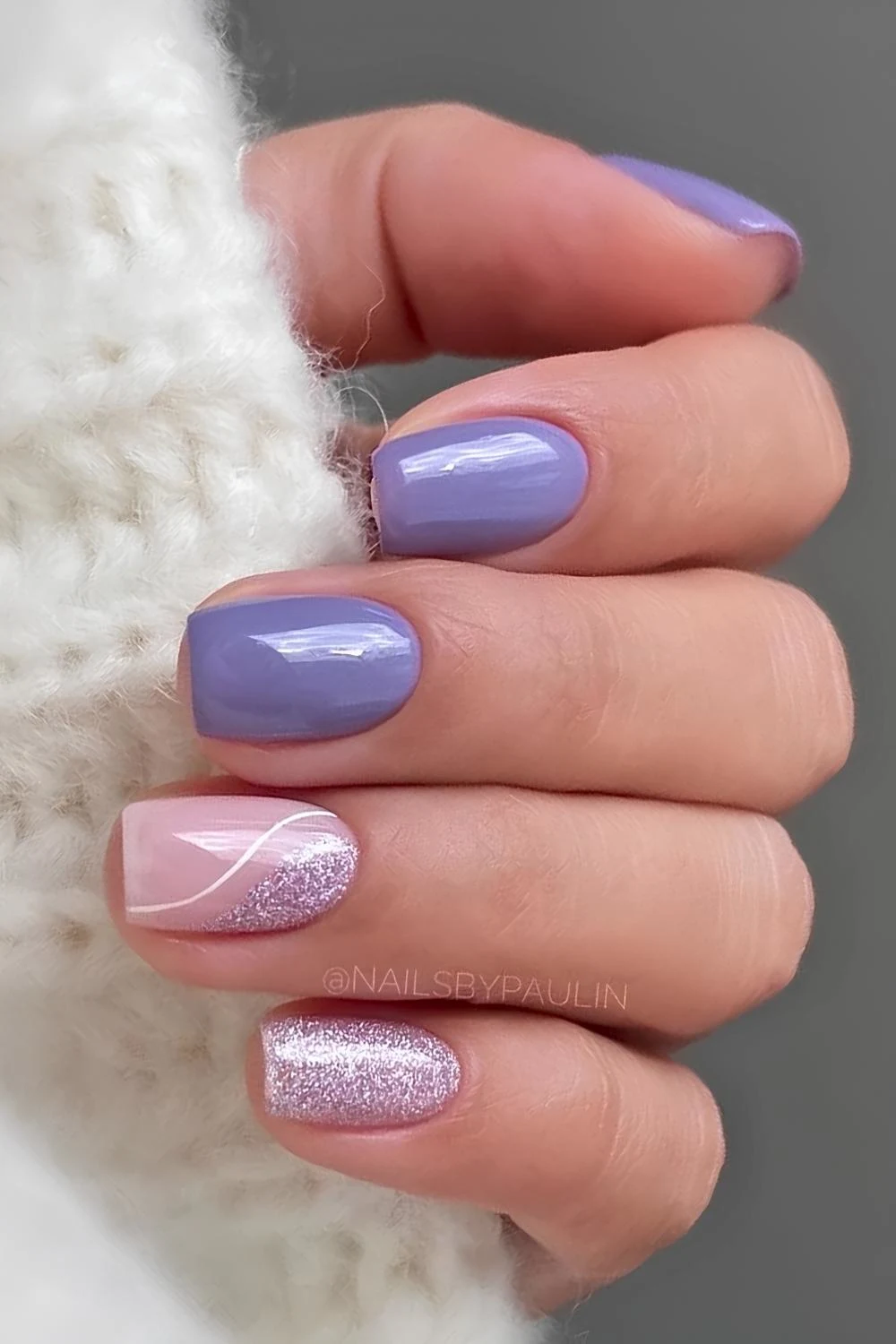 Purple nails with glitter and negative space art