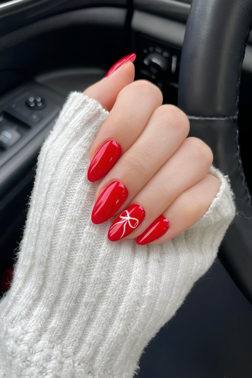 Red almond nails with bow accent