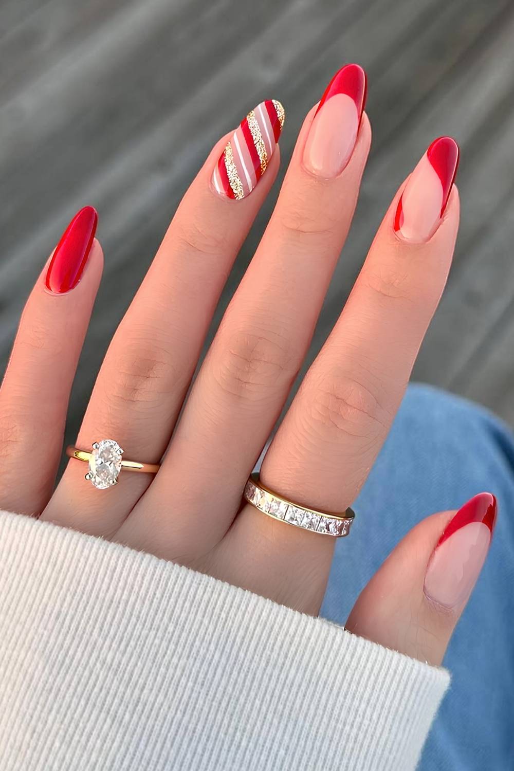 Red and gold Christmas mani with candy cane stripes