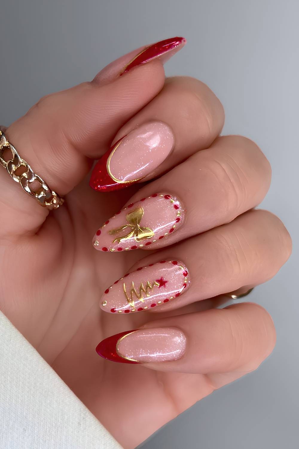Red and gold nails with festive Christmas art