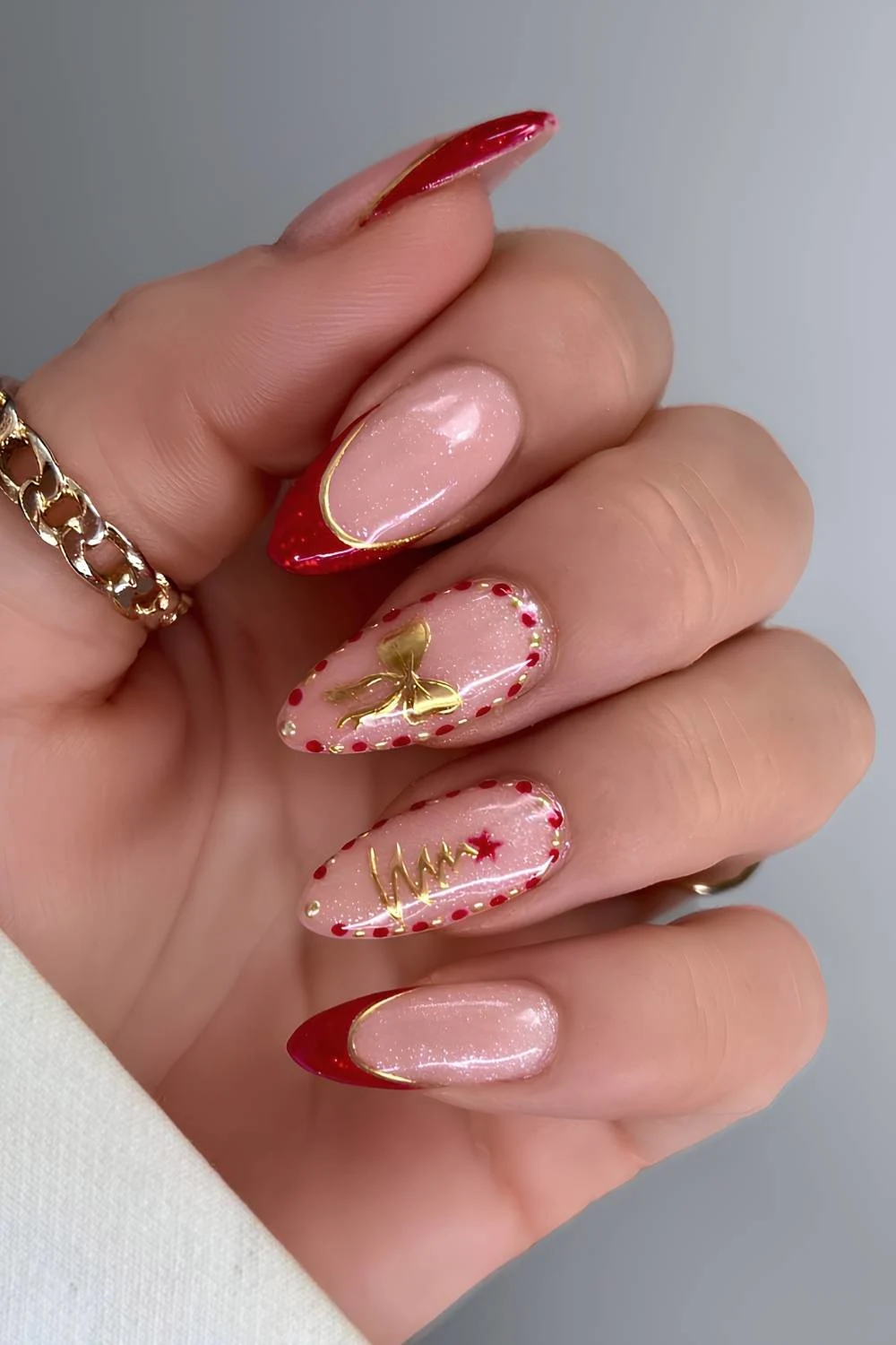 Red and gold nails with festive Christmas art