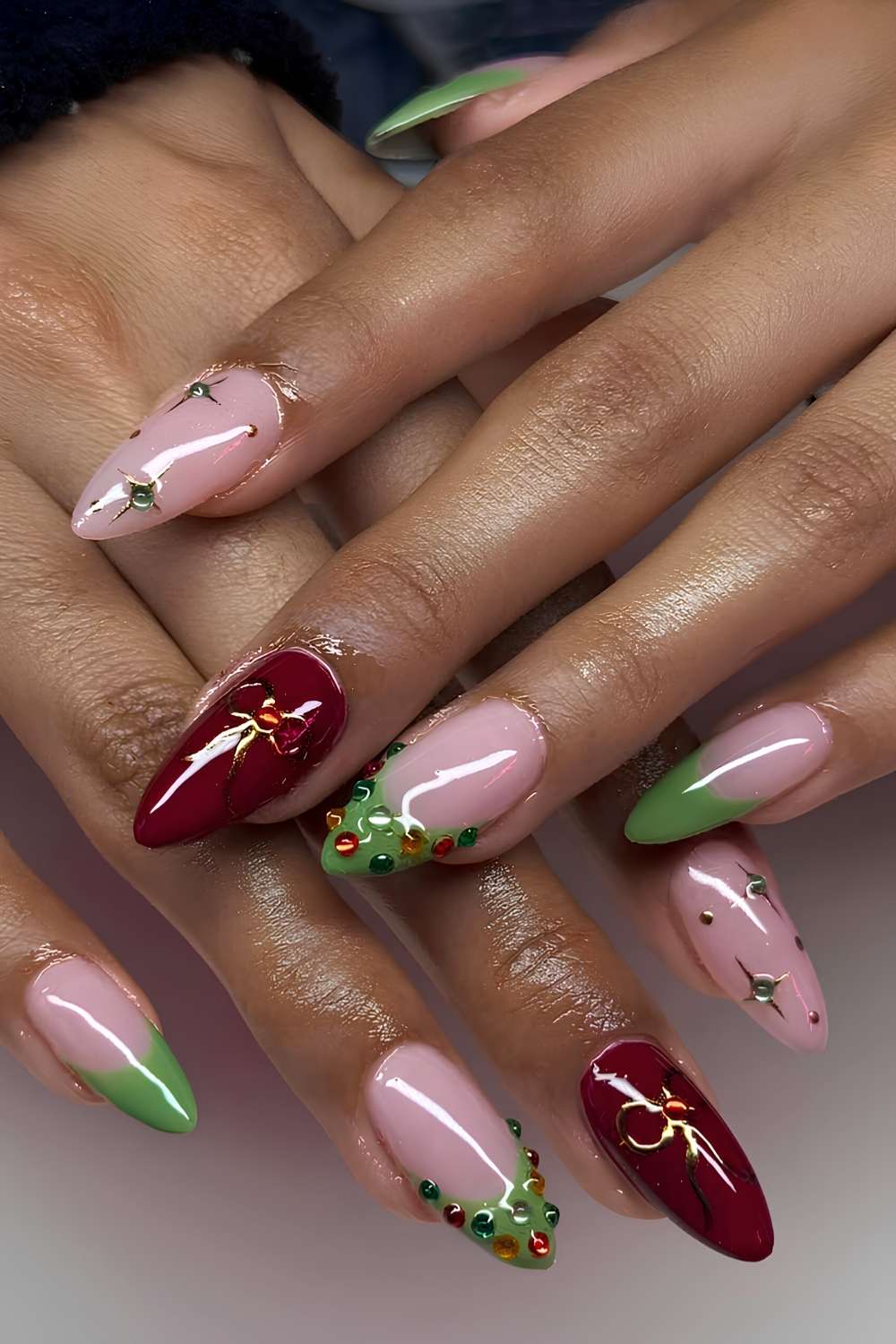 Red and green Christmas manicure with festive art