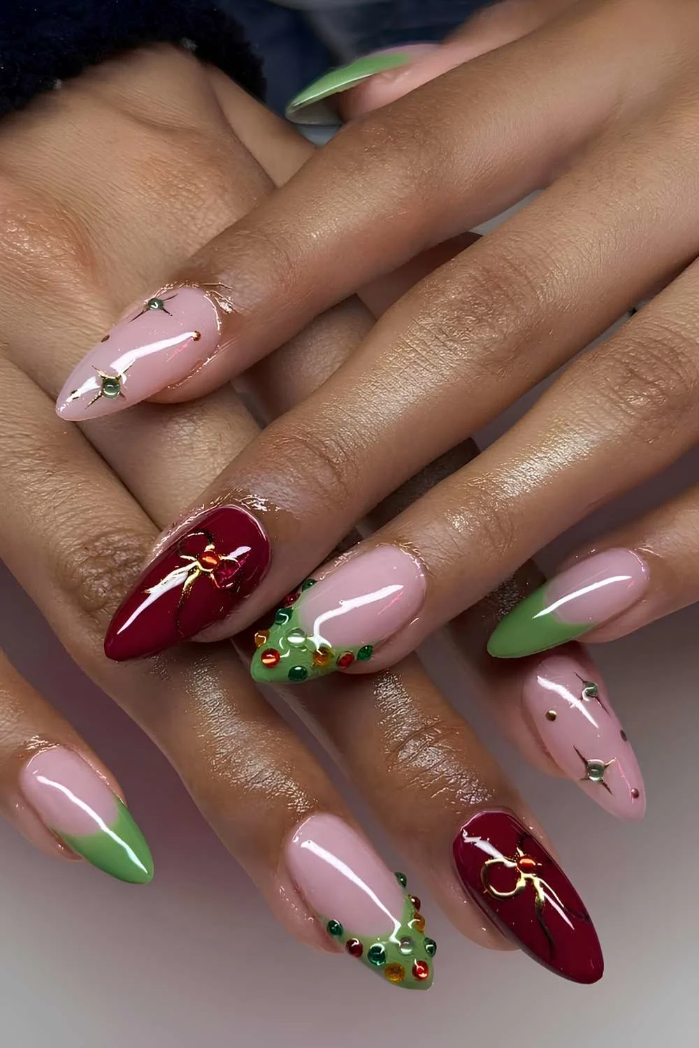 Red and green Christmas manicure with festive art