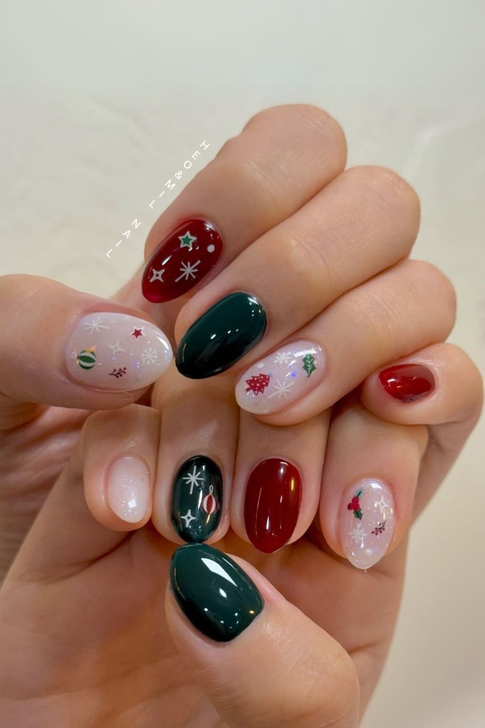 Red and green nails with Christmas ornament accent