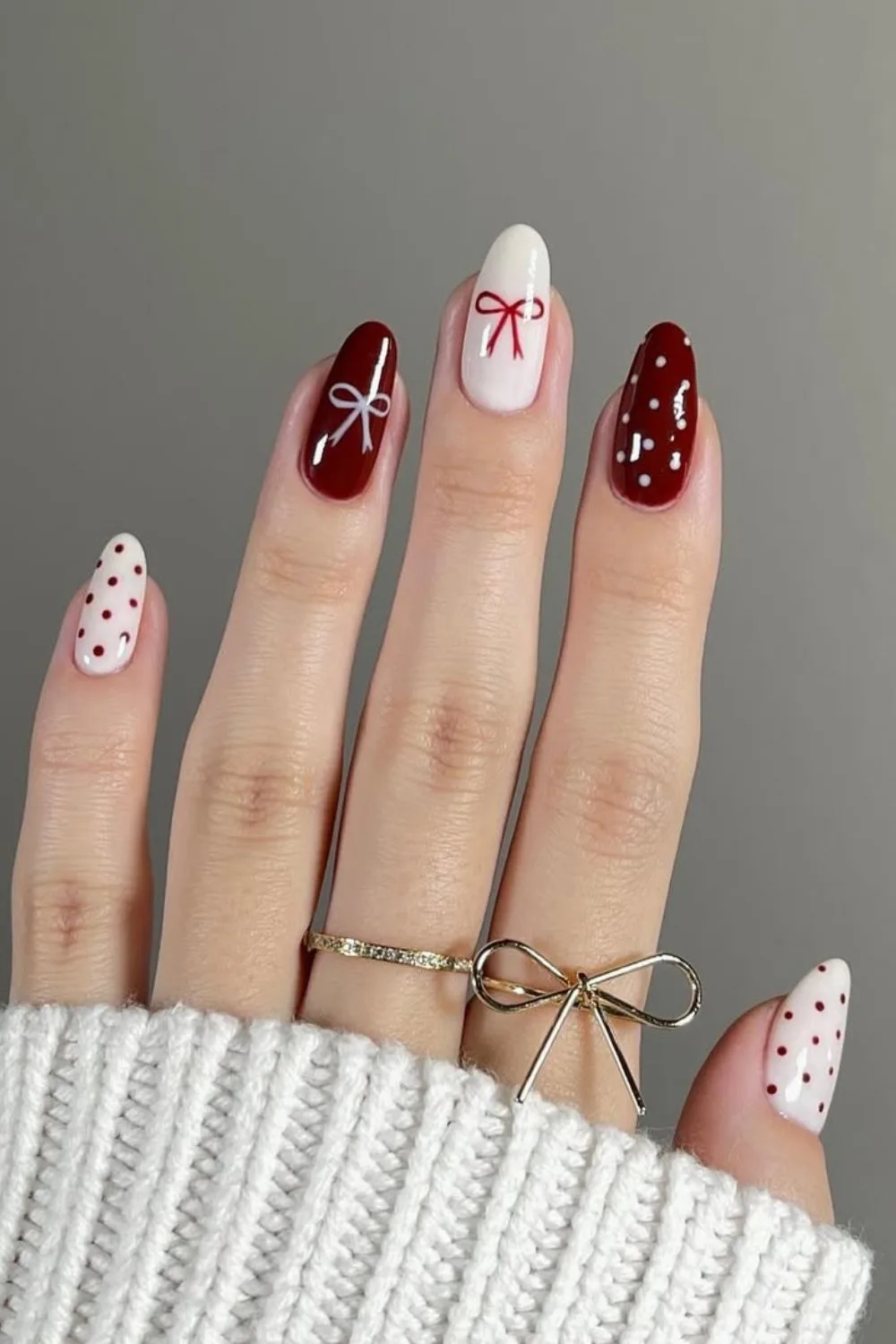 Red and white nails with bows and dots