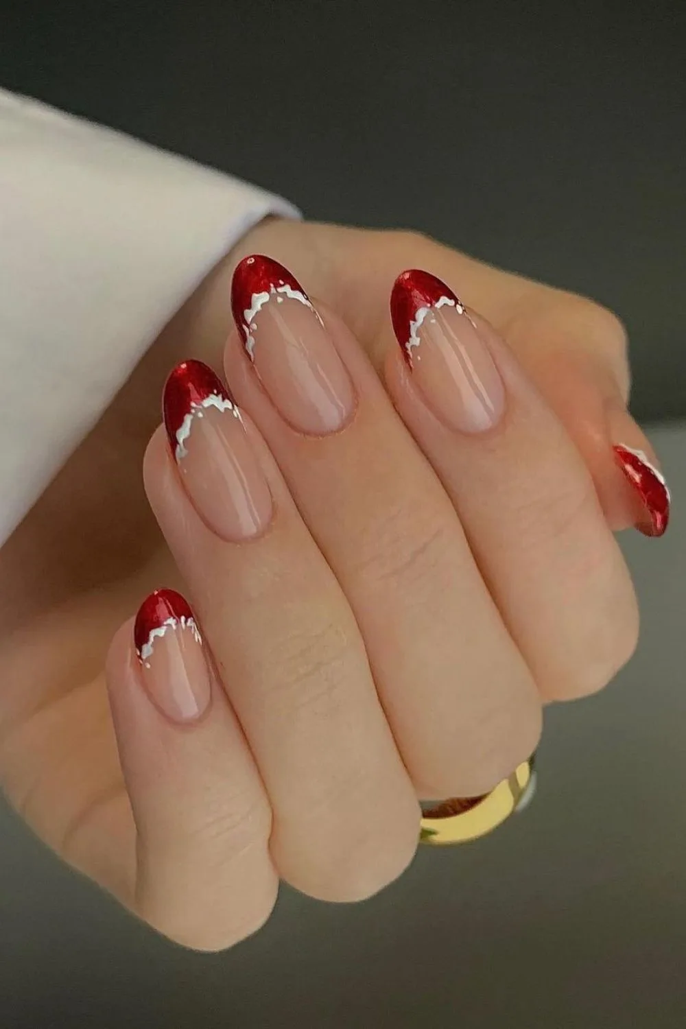 Red french tip nails with snowy accents