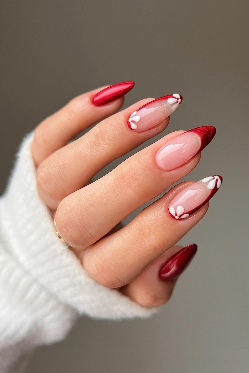 Red french tip nails with white flower accents