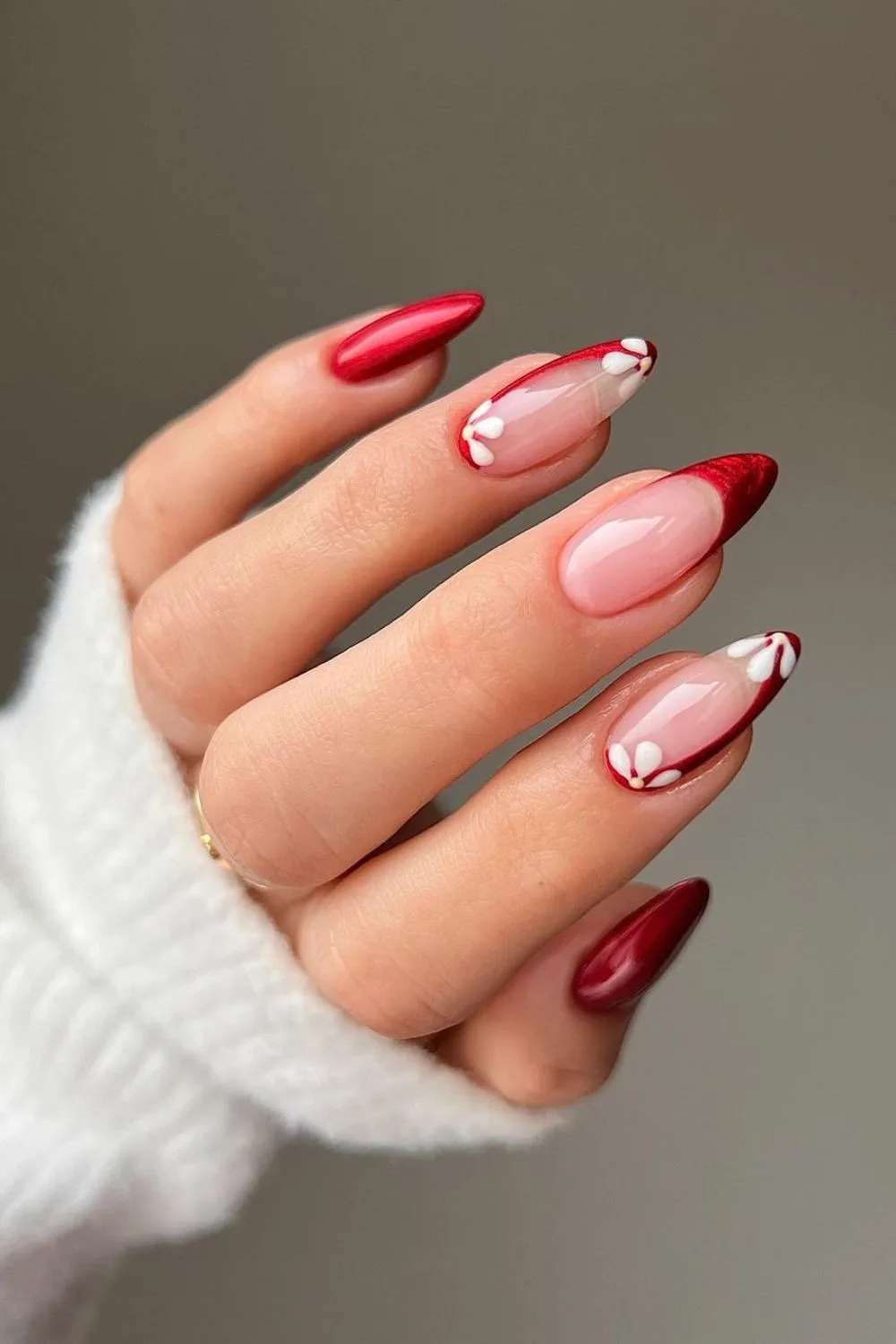 Red french tip nails with white flower accents