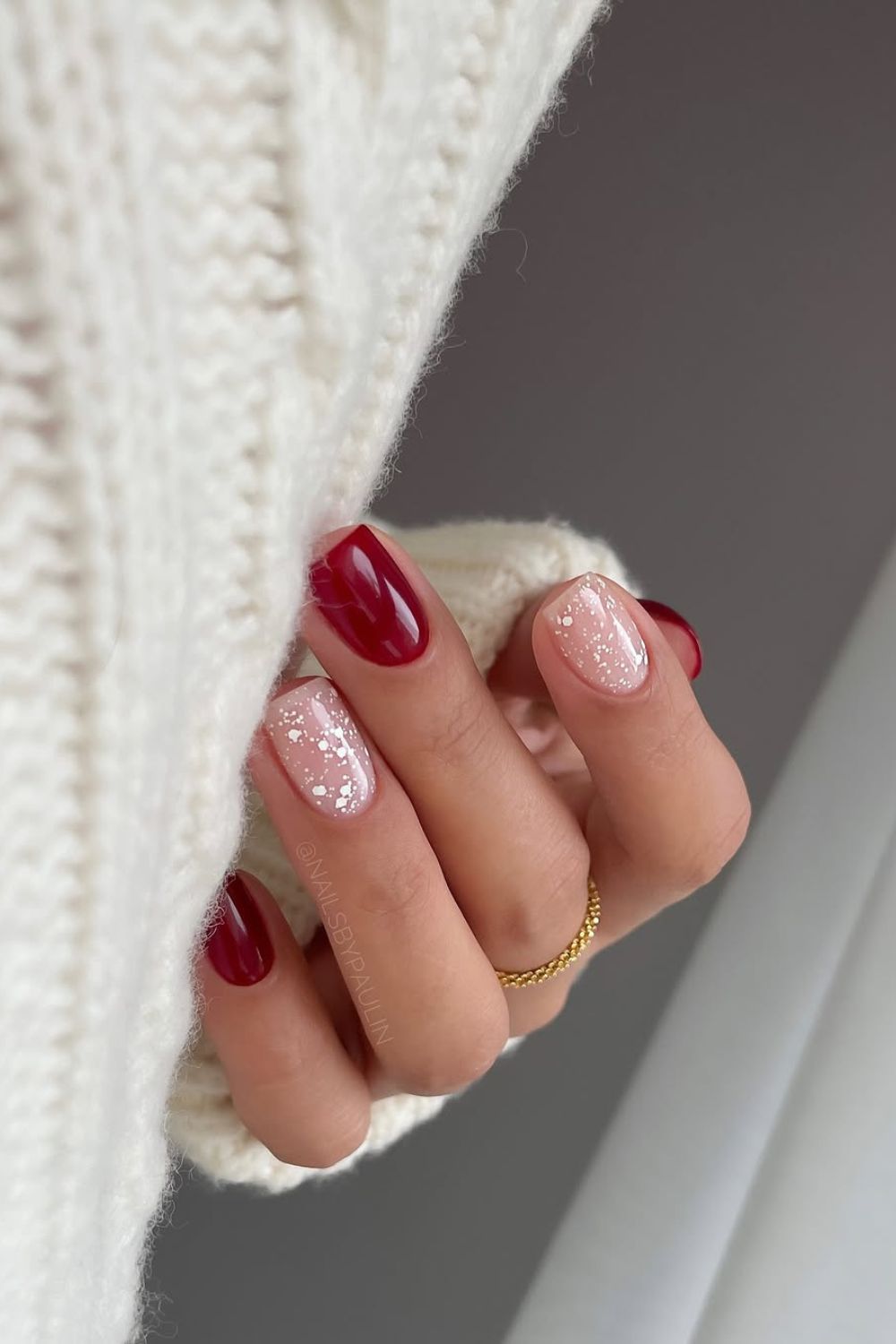 Red nails with snowy accent