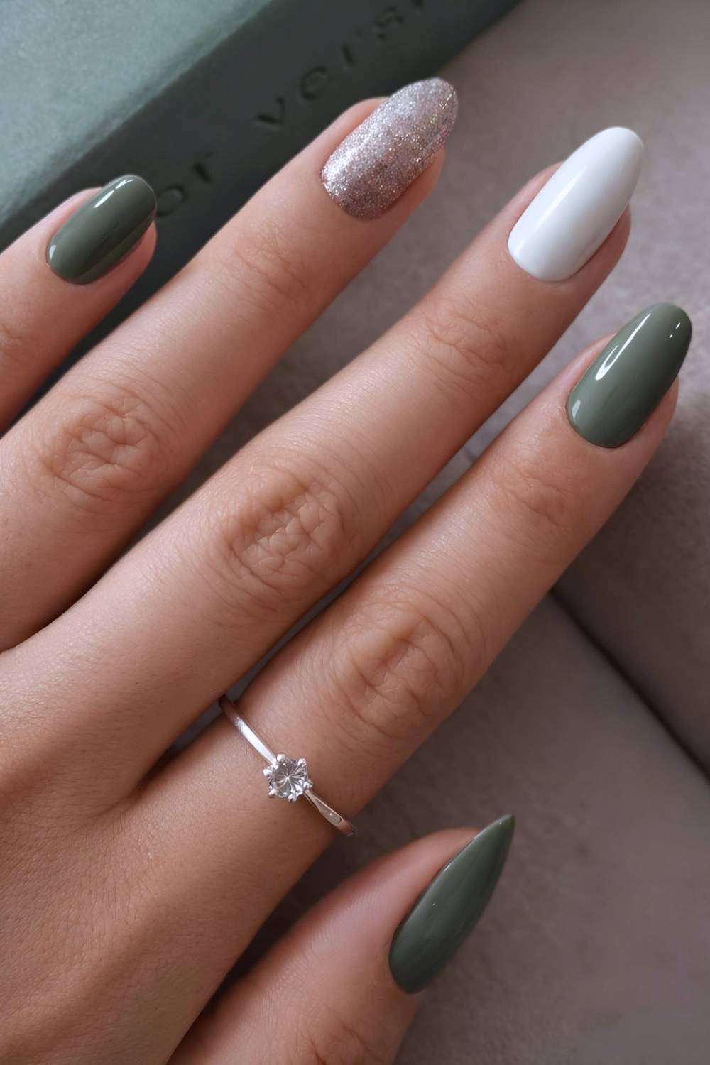 Sage green and white nails with glitter