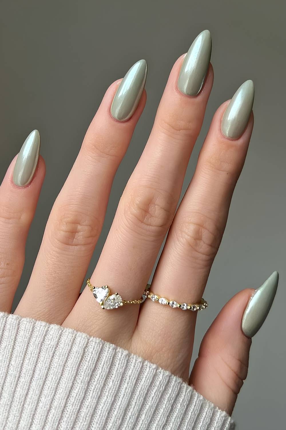 Sage green manicure with chrome finish