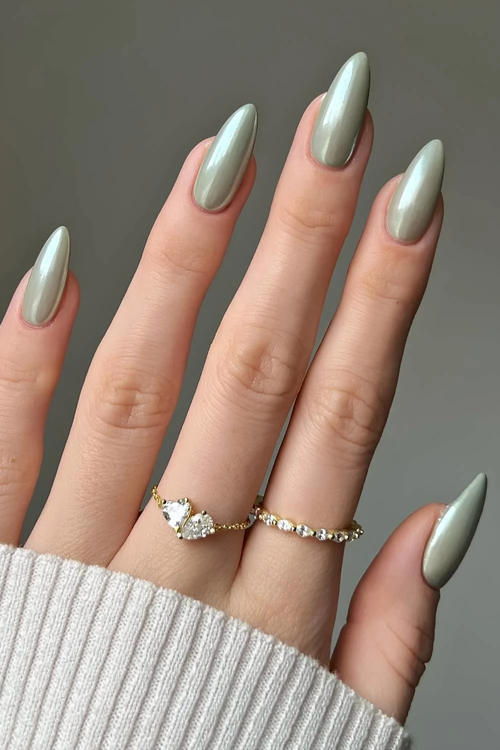 Sage green manicure with chrome finish