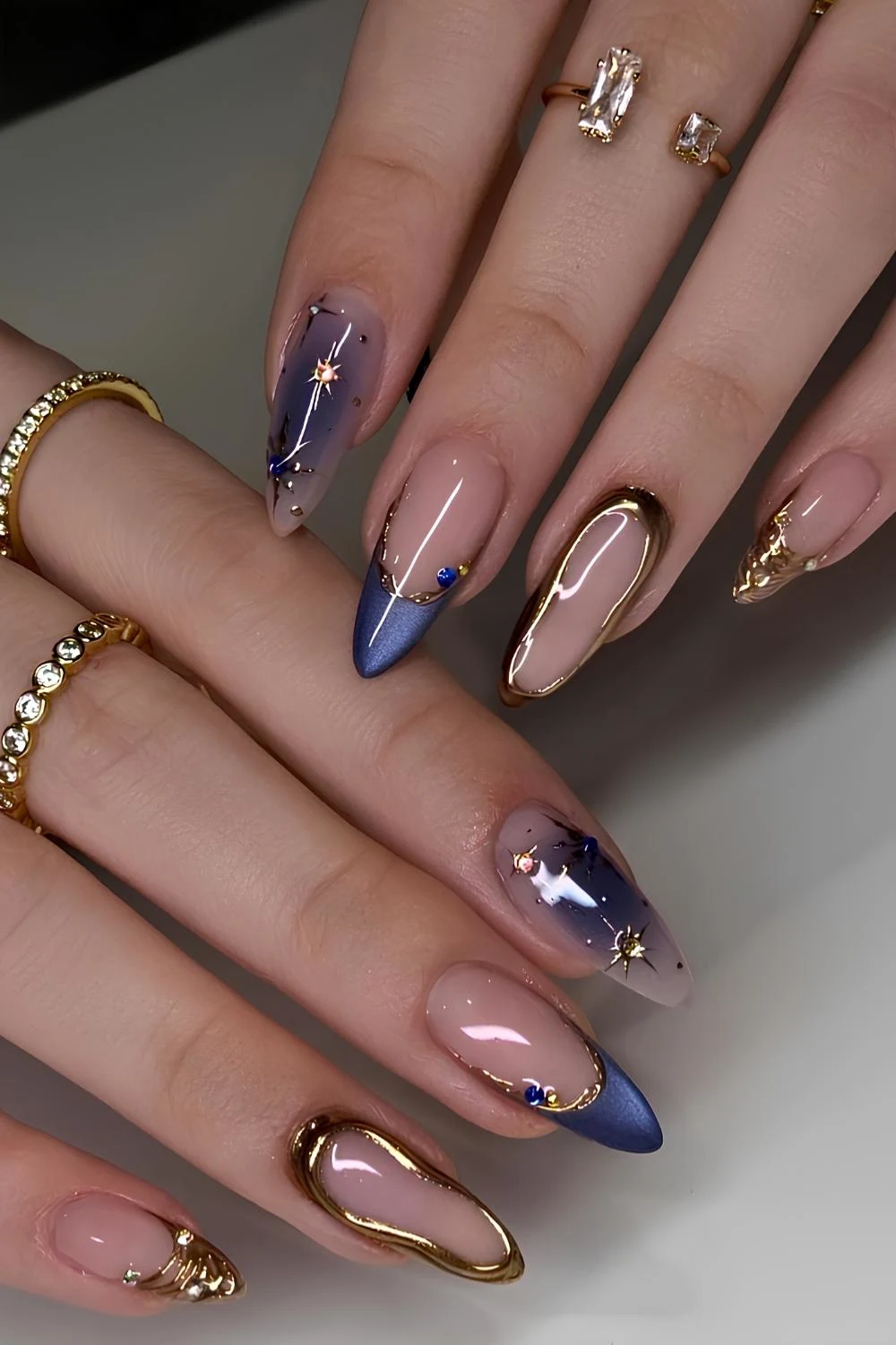 Sapphire blue cat eye nails with gold accents