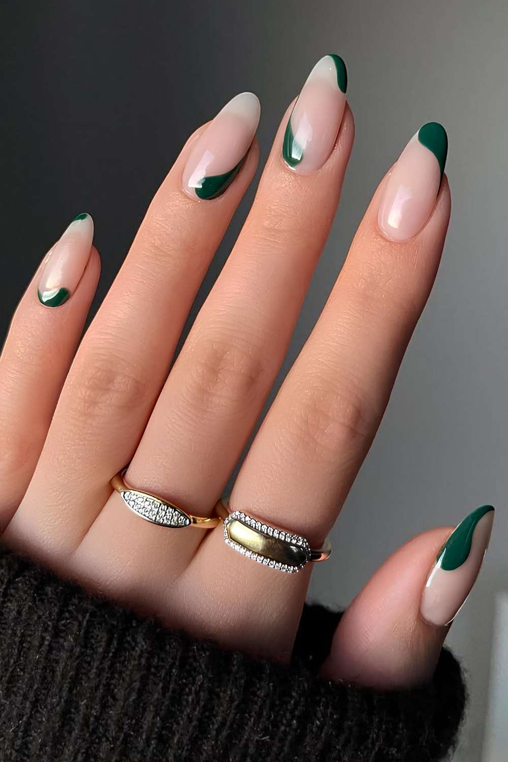 Sheer nails with dark green abstract shapes