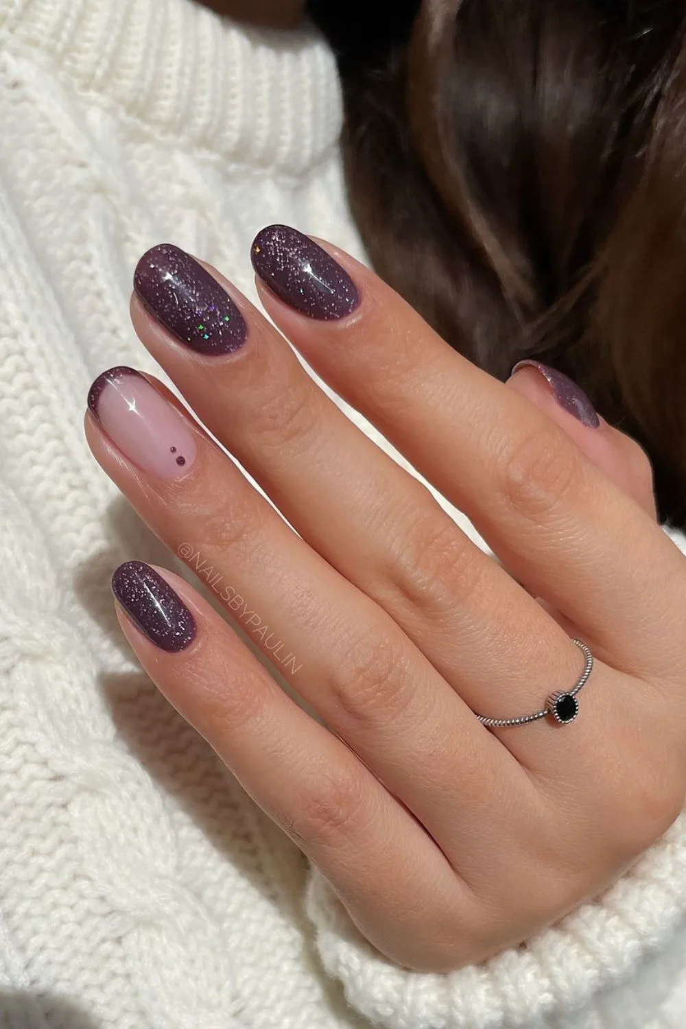 Shimmery purple nails with dot accents