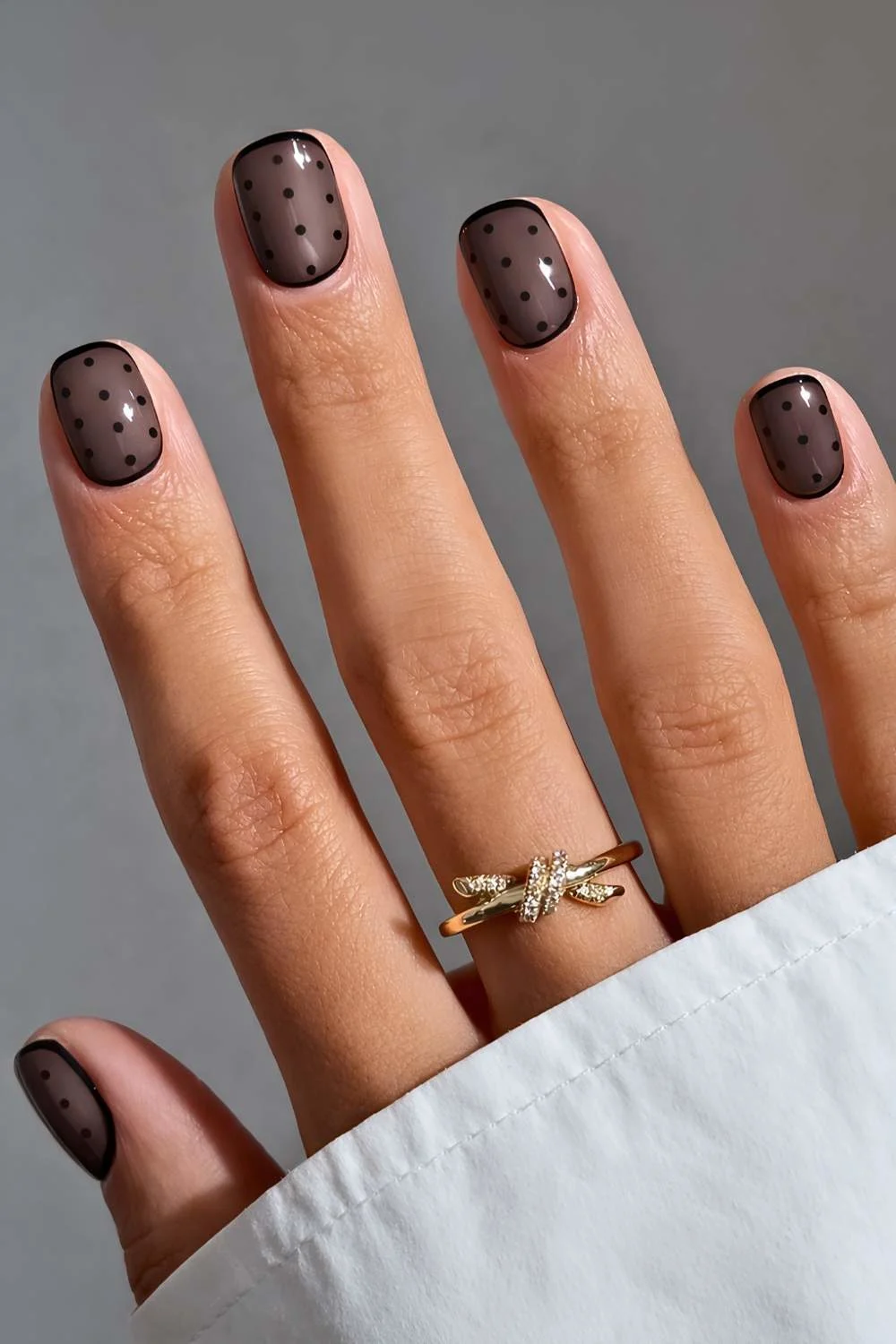 Short black polka dot manicure