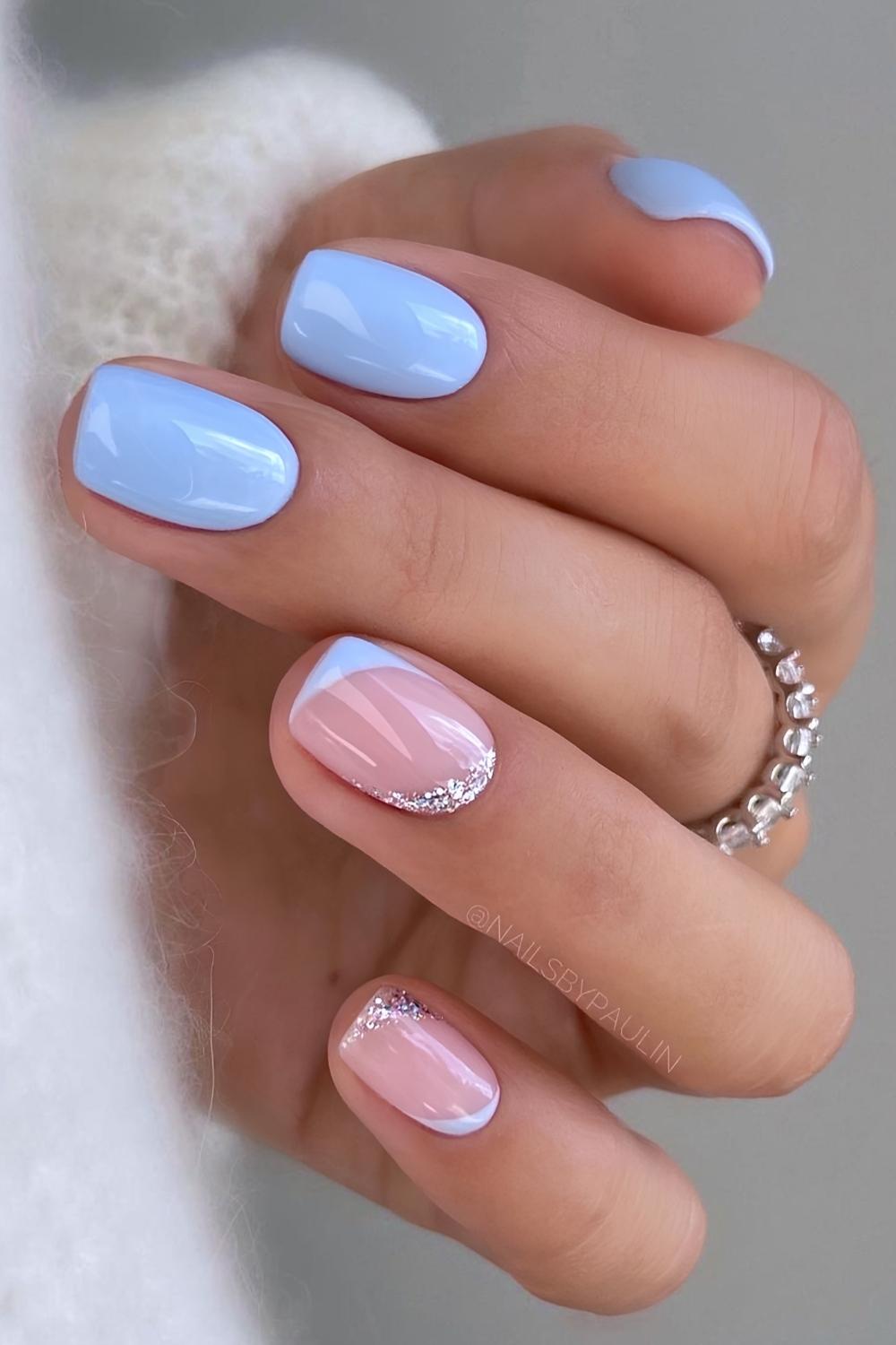 Short blue nails with glitter negative space accent