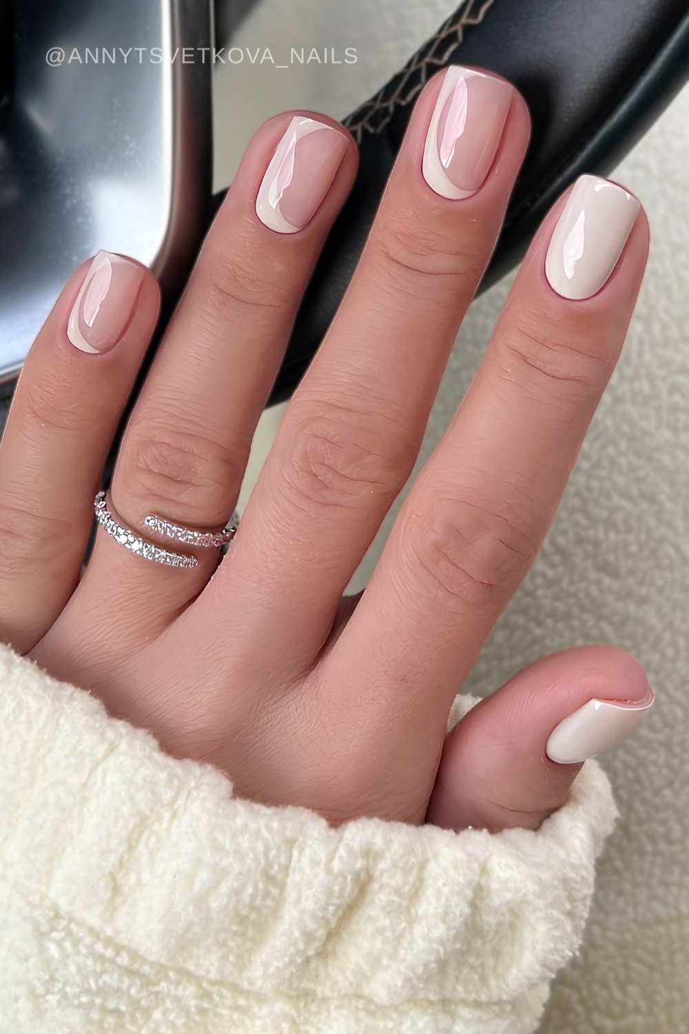 Short milky beige nails with negative space art –