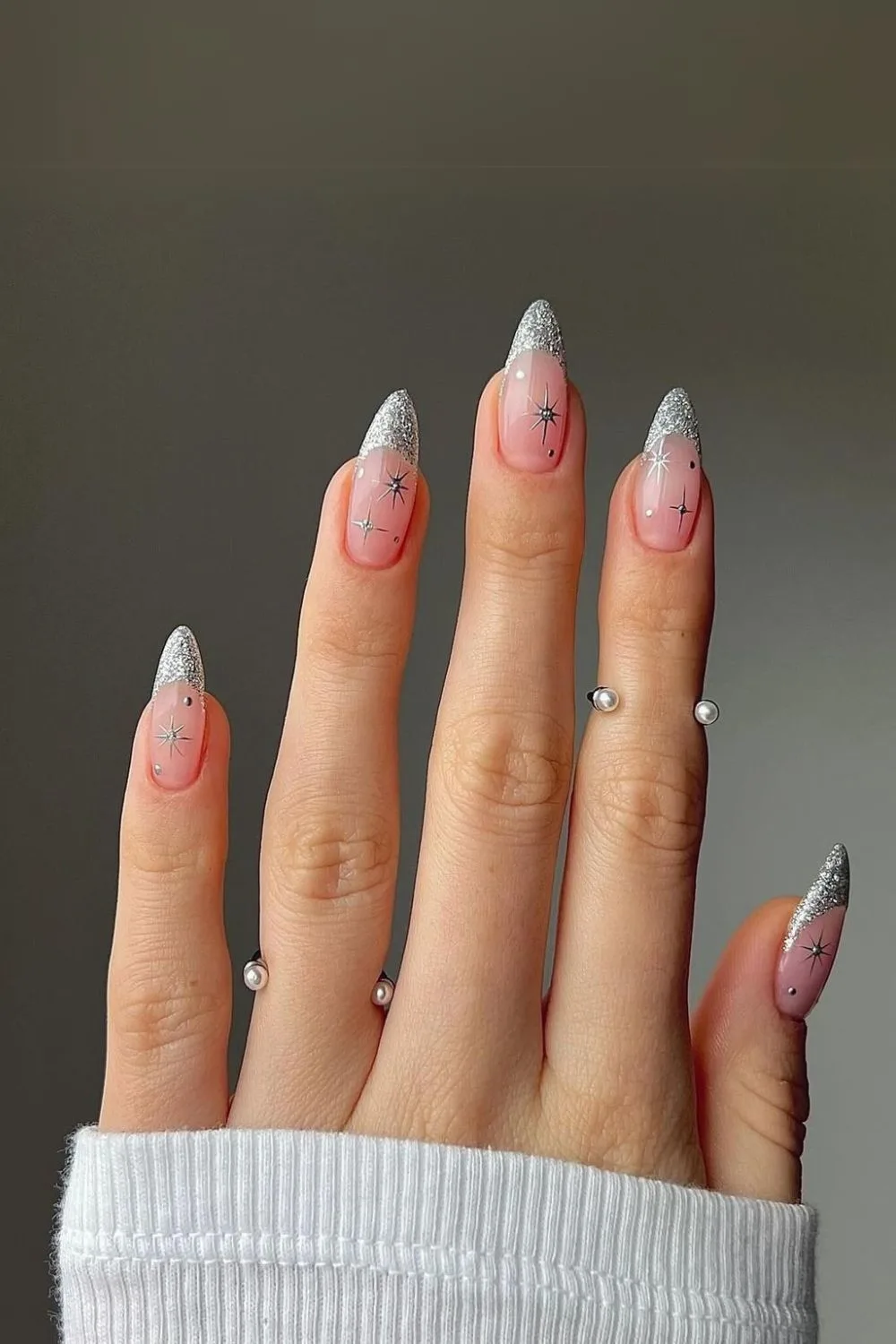 Silver glitter French tip nails with star accents