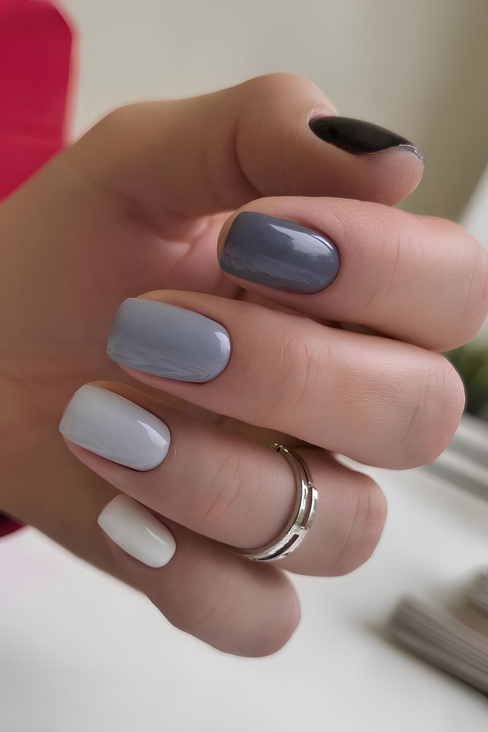 Skittle nails in different shades of gray