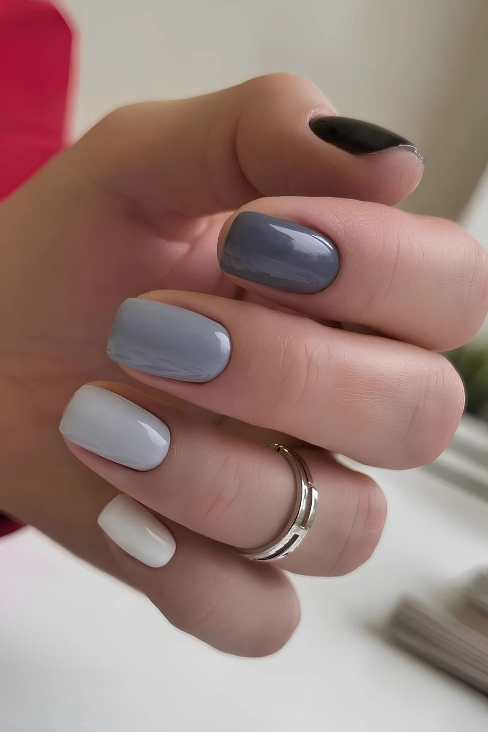 Skittle nails in different shades of gray