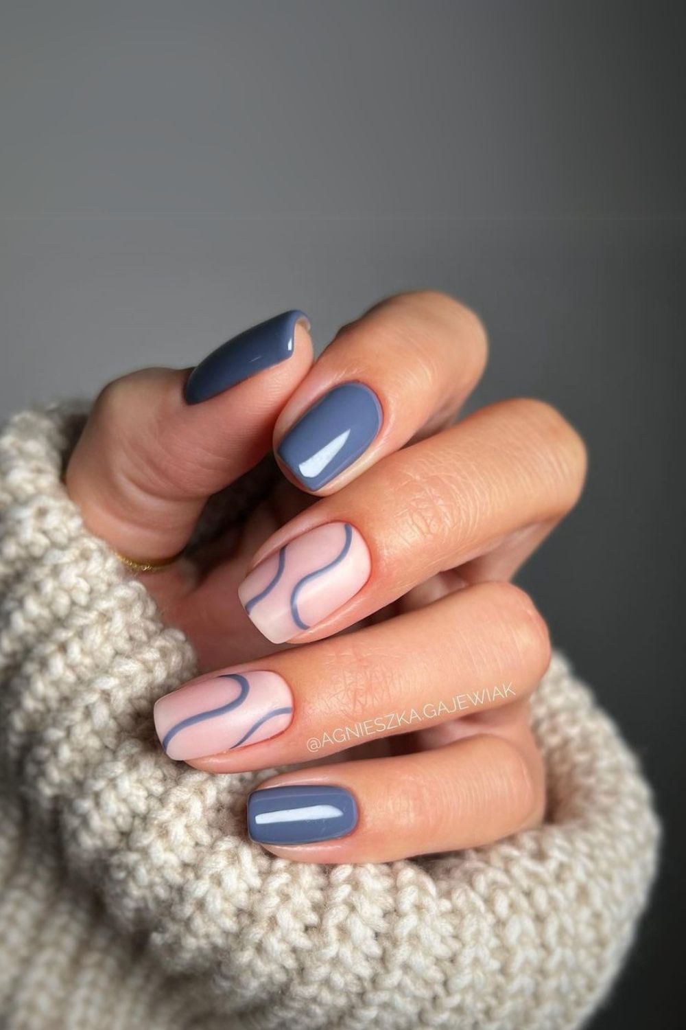 Slate blue nails with swirl accent